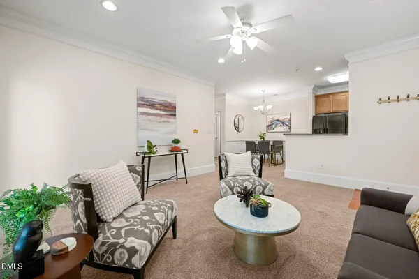 a living room with furniture and a table