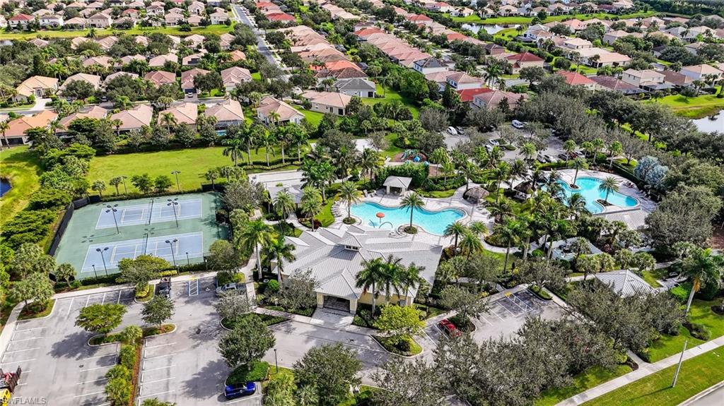 2126 Hamlin Street Naples, FL 34120 - Photo 31 of 34 an aerial view of residential houses with outdoor space and trees all around