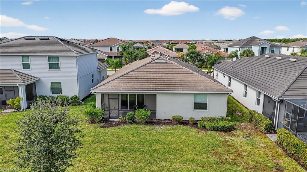 2126 Hamlin Street Naples, FL 34120 - Photo 32 of 34 a front view of a house with a yard