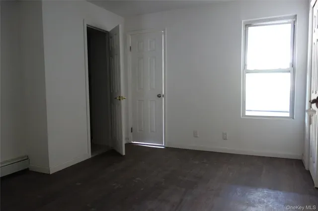 an empty room with a empty space and window