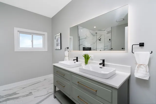 a bathroom with a sink and a mirror