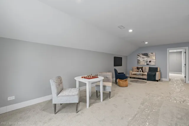 a view of a livingroom with furniture and a fireplace