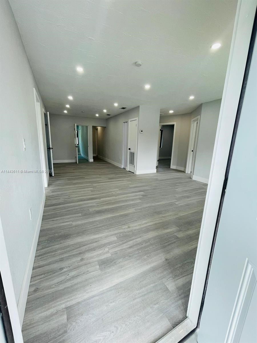 2521 Northwest 121st Street Miami, FL 33167 - Photo 15 of 43 a view of a hallway with stairs