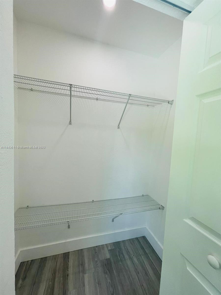 2521 Northwest 121st Street Miami, FL 33167 - Photo 31 of 43 a view of a room with racks on the wall