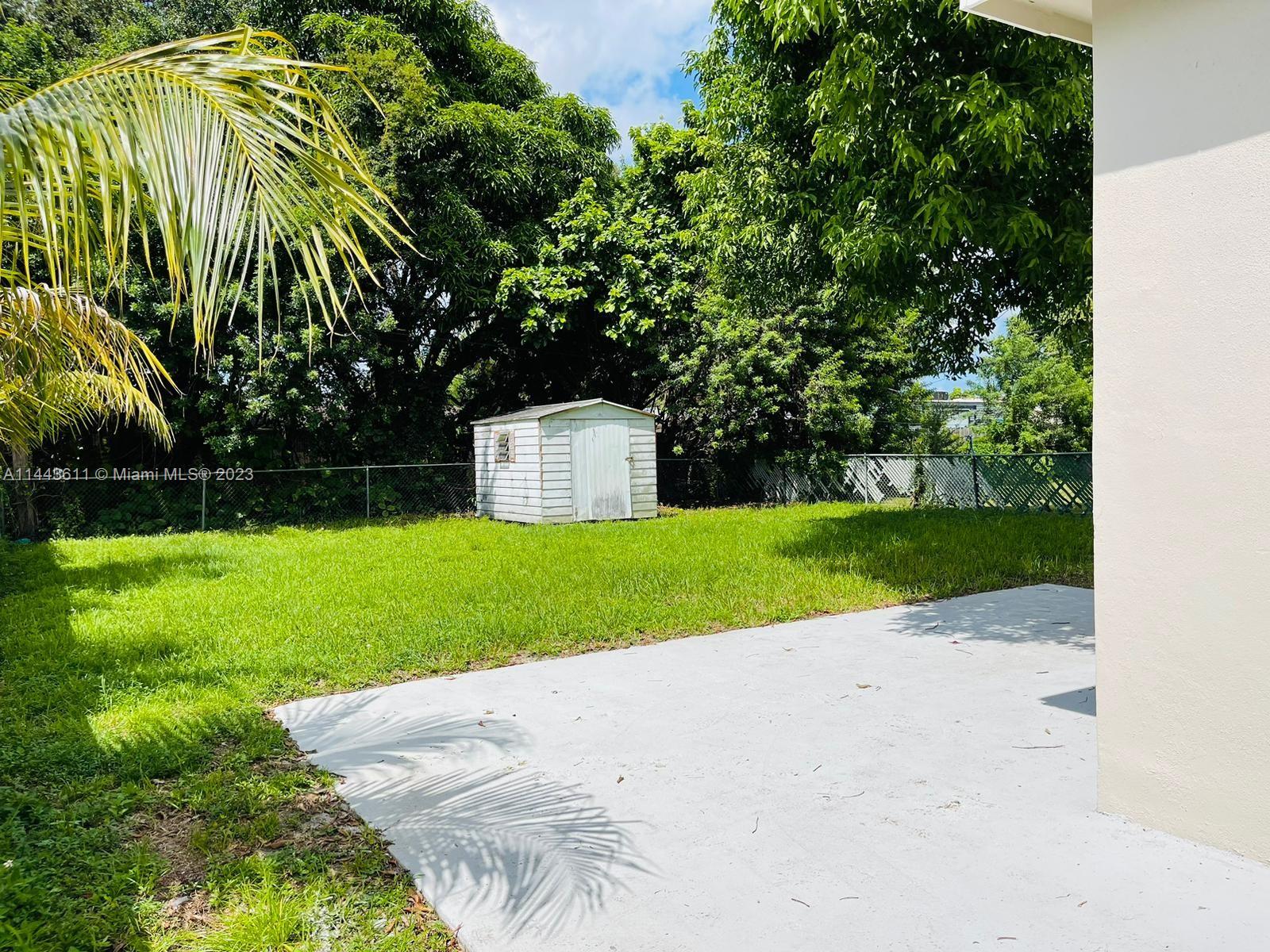 2521 Northwest 121st Street Miami, FL 33167 - Photo 34 of 43 a view of a back yard of the house