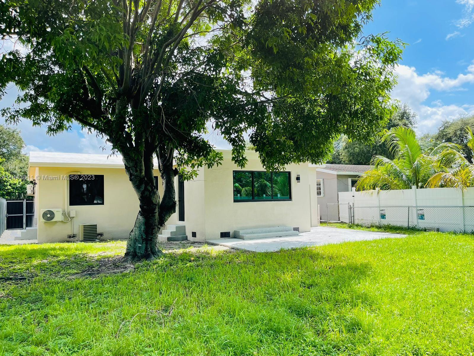 2521 Northwest 121st Street Miami, FL 33167 - Photo 40 of 43 a view of a house with a backyard