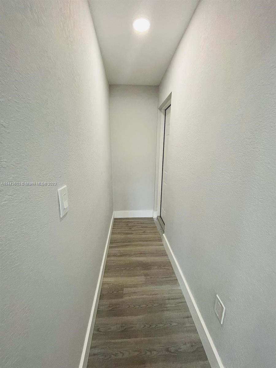 2521 Northwest 121st Street Miami, FL 33167 - Photo 8 of 43 a view of hallway with stairs