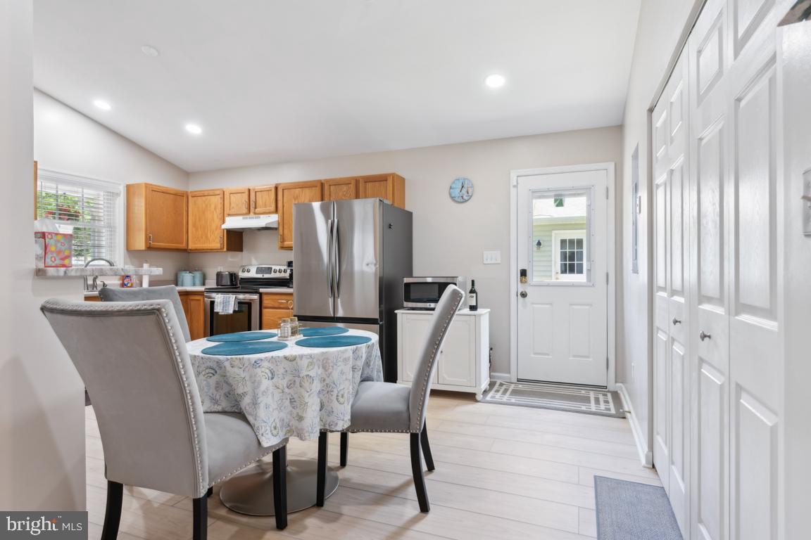 340 A 12th Street Colonial Beach, VA 22443 - Photo 15 of 29 a dining room filled chandelier and kitchen view