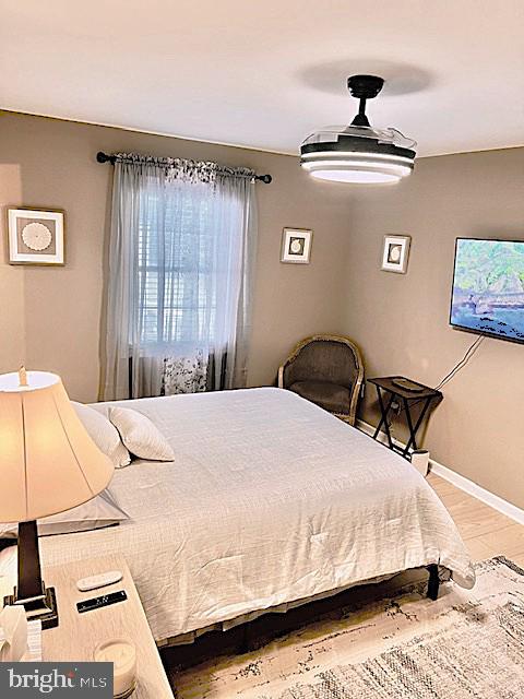 340 A 12th Street Colonial Beach, VA 22443 - Photo 20 of 29 a bedroom with a bed and dresser