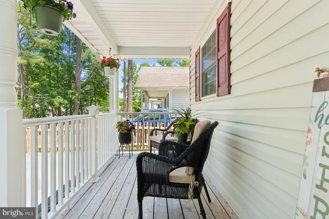 a view of a two chairs in the balcony