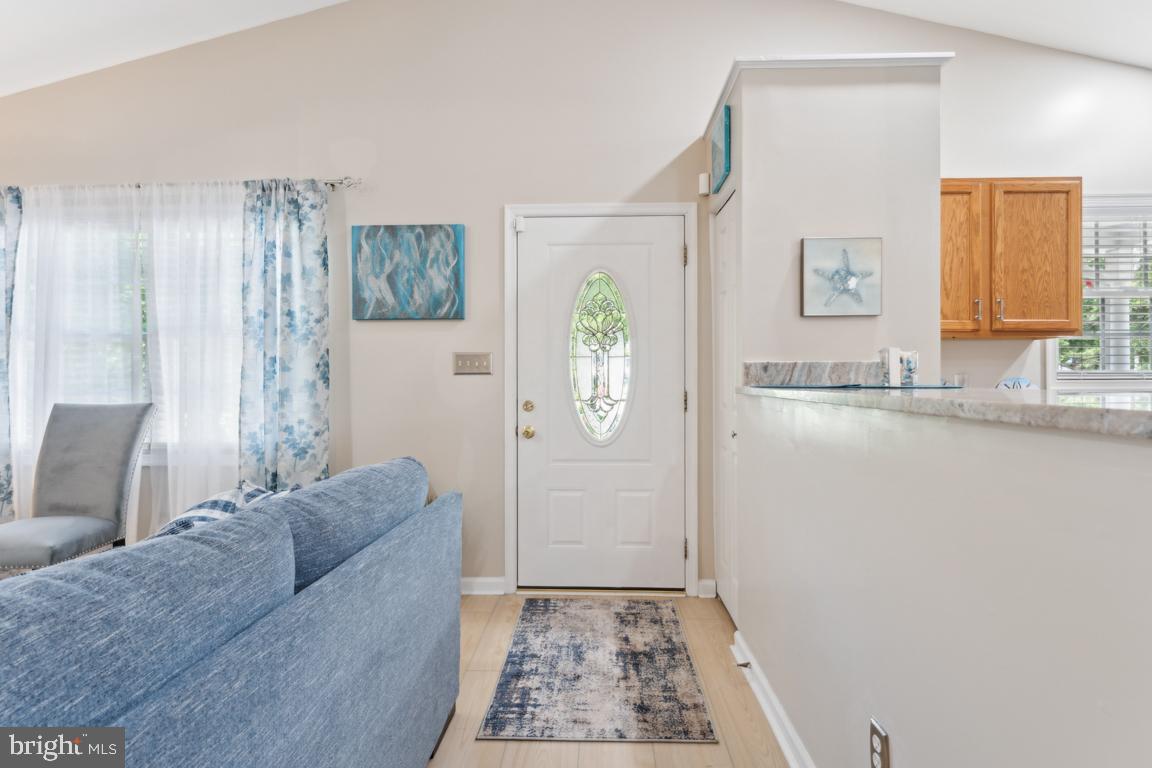 340 A 12th Street Colonial Beach, VA 22443 - Photo 7 of 29 a living room with a couch and a sink