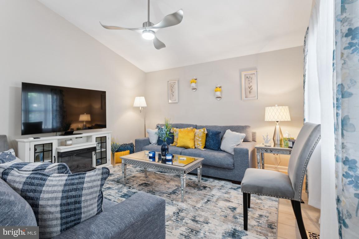 340 A 12th Street Colonial Beach, VA 22443 - Photo 10 of 29 a living room with furniture and a flat screen tv