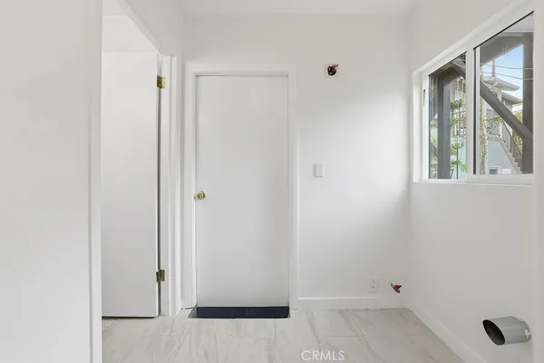 a view of entryway with wooden floor