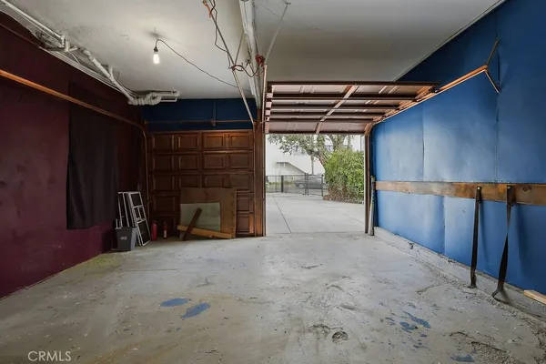 a view of an empty room with a fireplace