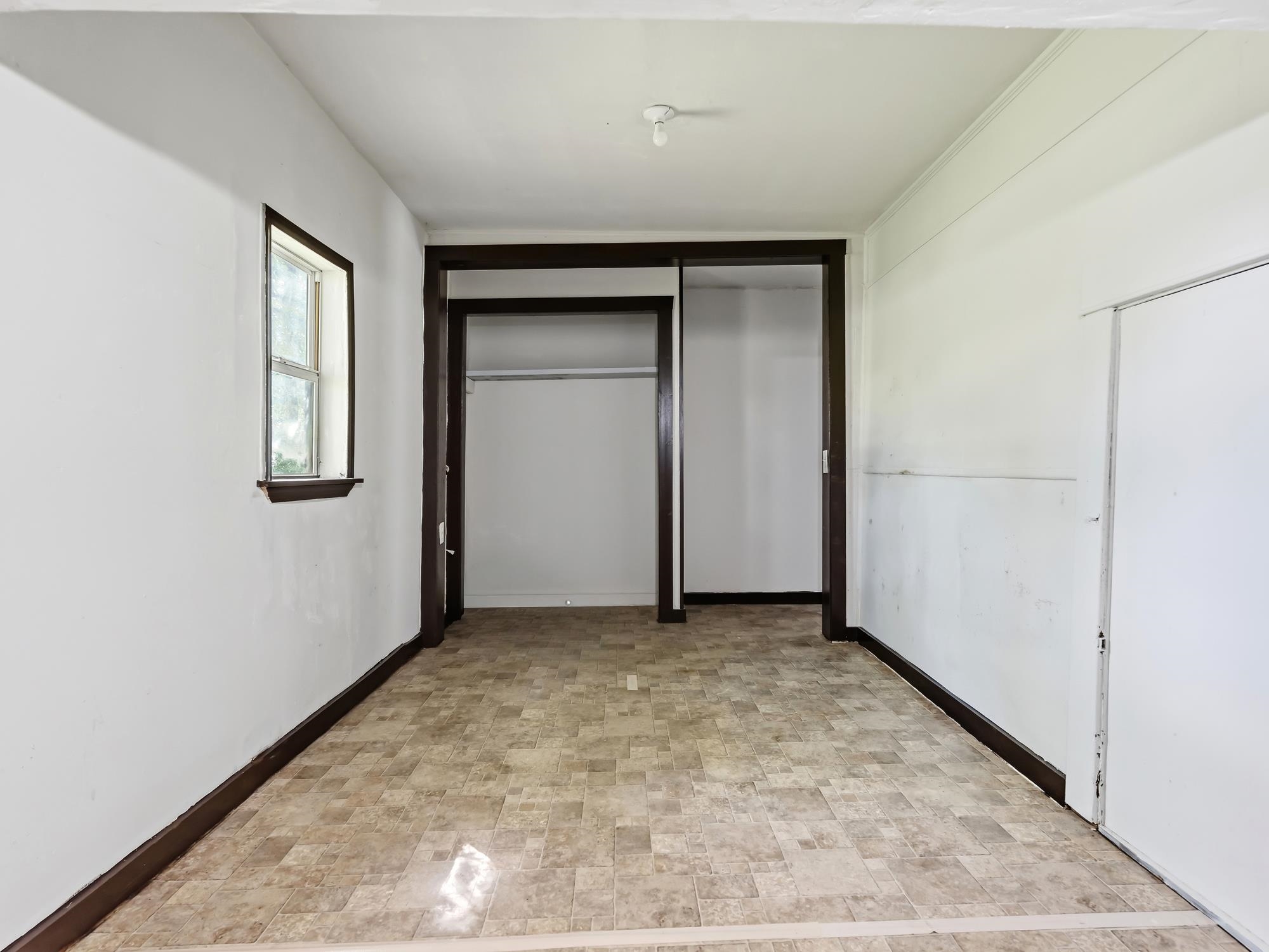 737 9th Street Port Arthur, TX 77640 - Photo 16 of 20 an empty room with windows and closet