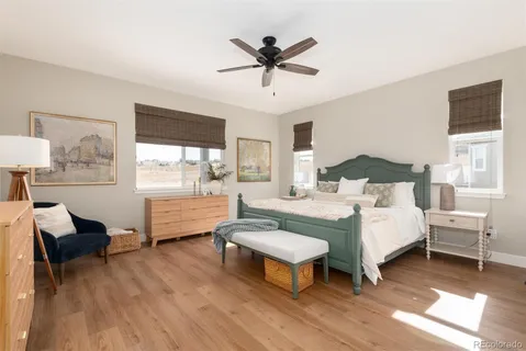 a spacious bedroom with a bed and a table