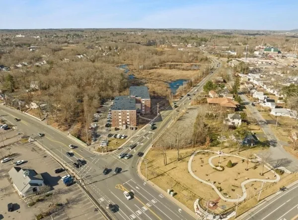 an aerial view of residential building and parking space