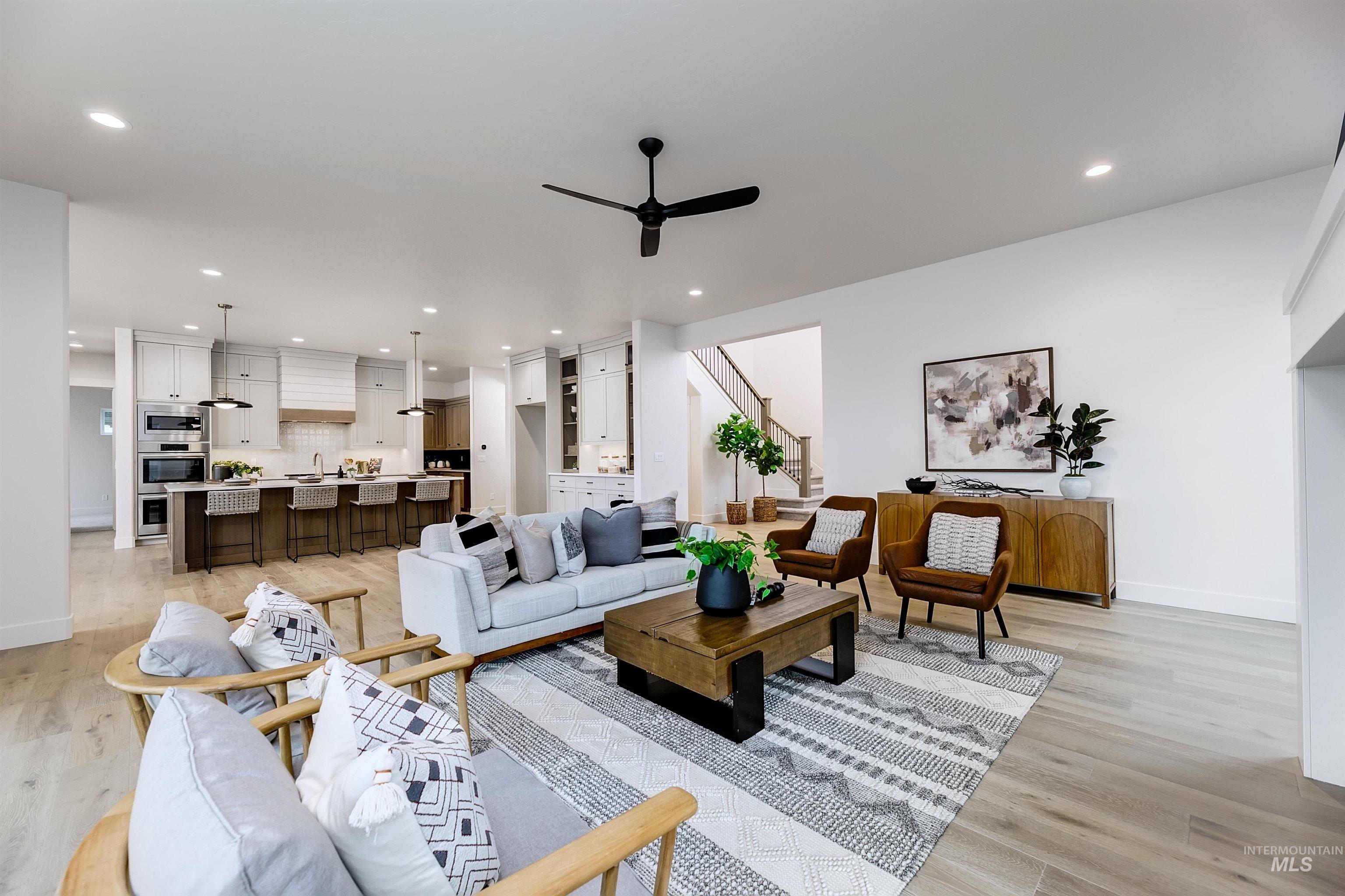 13331 North Spring Creek Way Boise, ID 83714 - Photo 2 of 43 Living area featuring light wood-style floors, ceiling fan, and recessed lighting