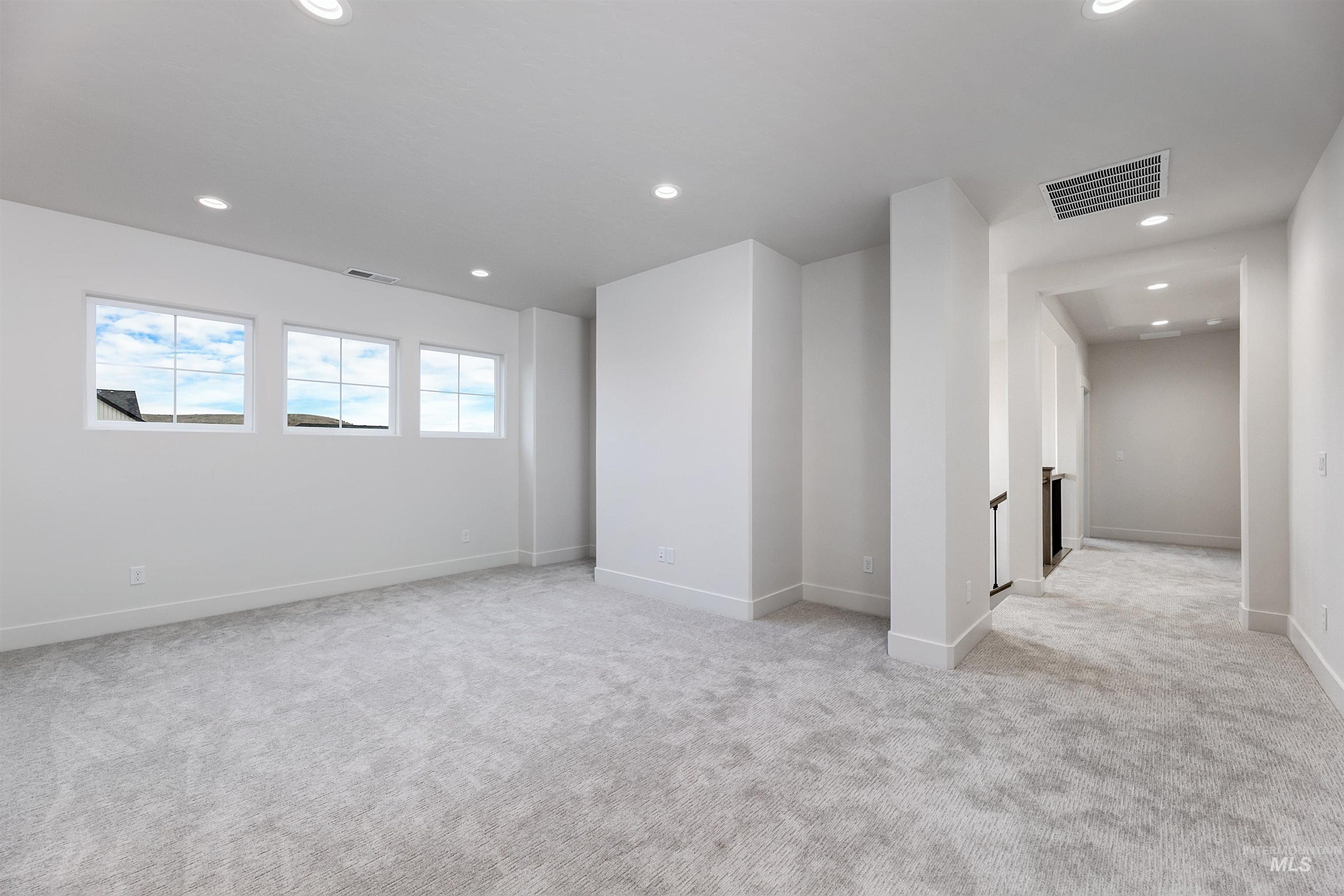 13331 North Spring Creek Way Boise, ID 83714 - Photo 30 of 43 Unfurnished room with light carpet and recessed lighting