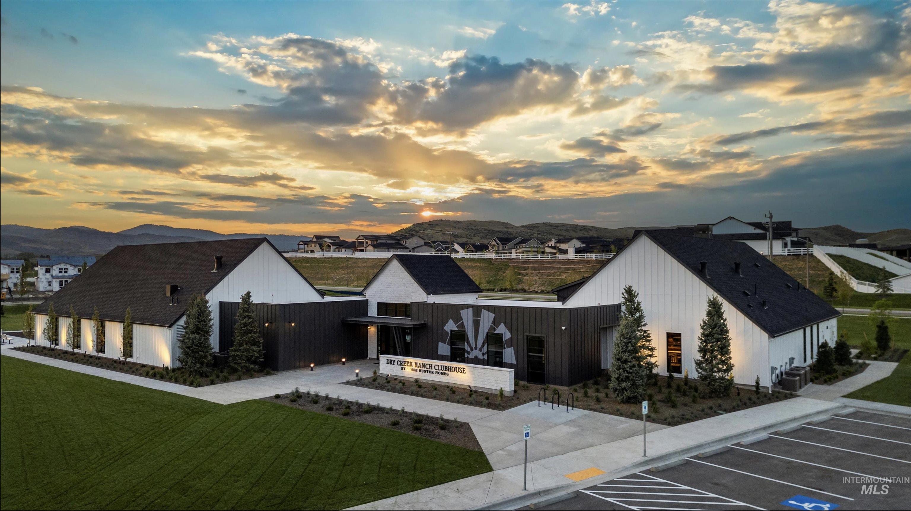 13331 North Spring Creek Way Boise, ID 83714 - Photo 32 of 43 View of building exterior featuring a mountain view and uncovered parking