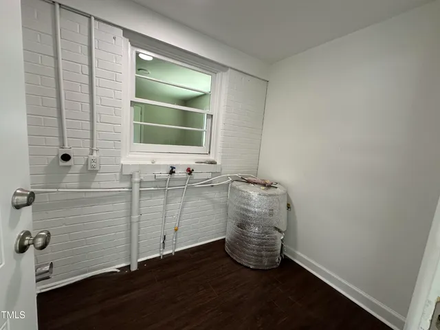 a backyard of a house with sofas