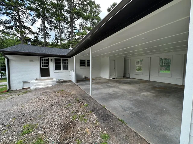 a house with trees in the background