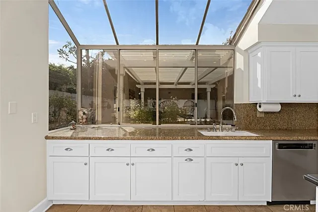 a view of a bathroom with a tub and window