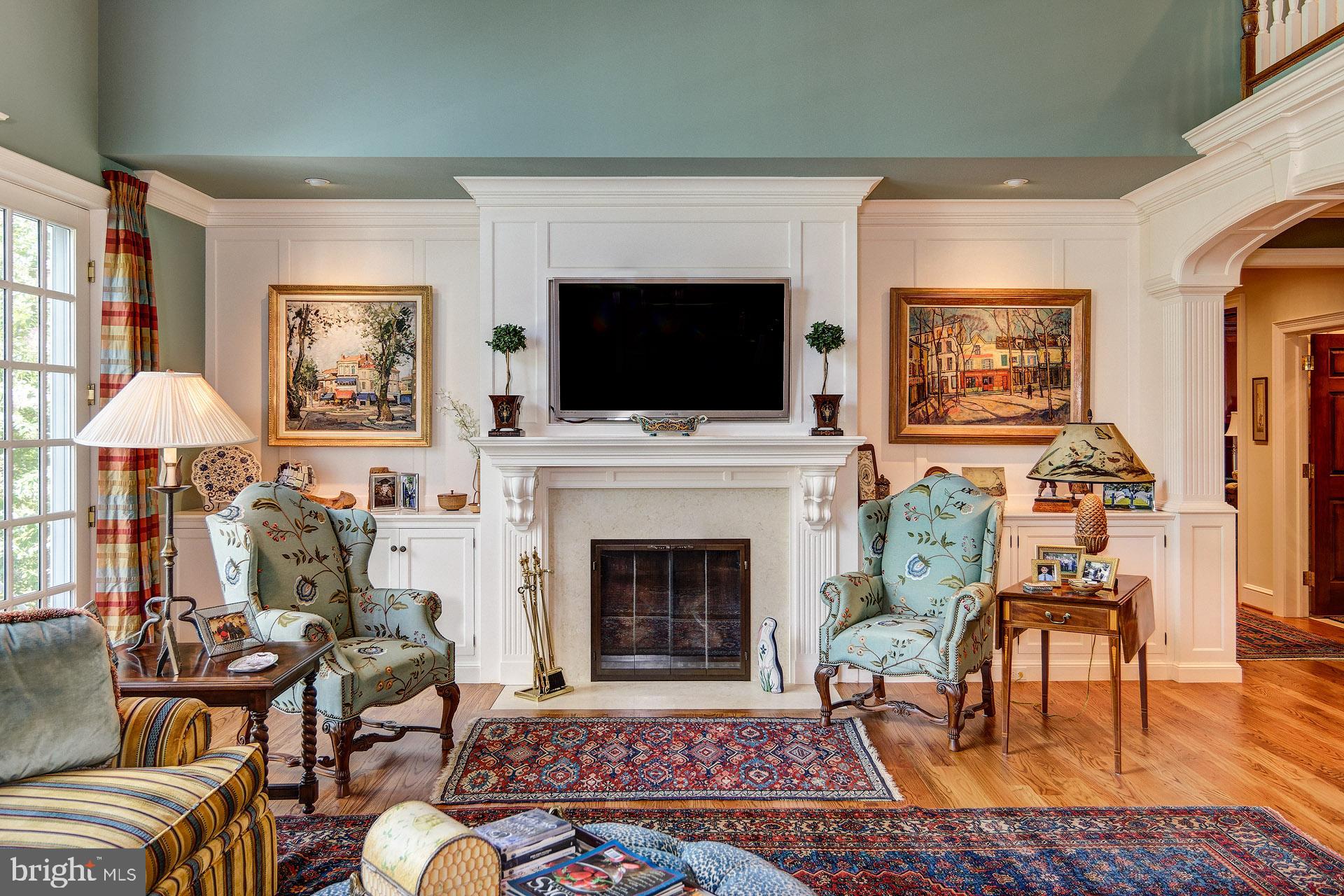 135 Winding Way Haddonfield, NJ 08033 - Photo 22 of 100 a living room with furniture a flat screen tv and a fireplace
