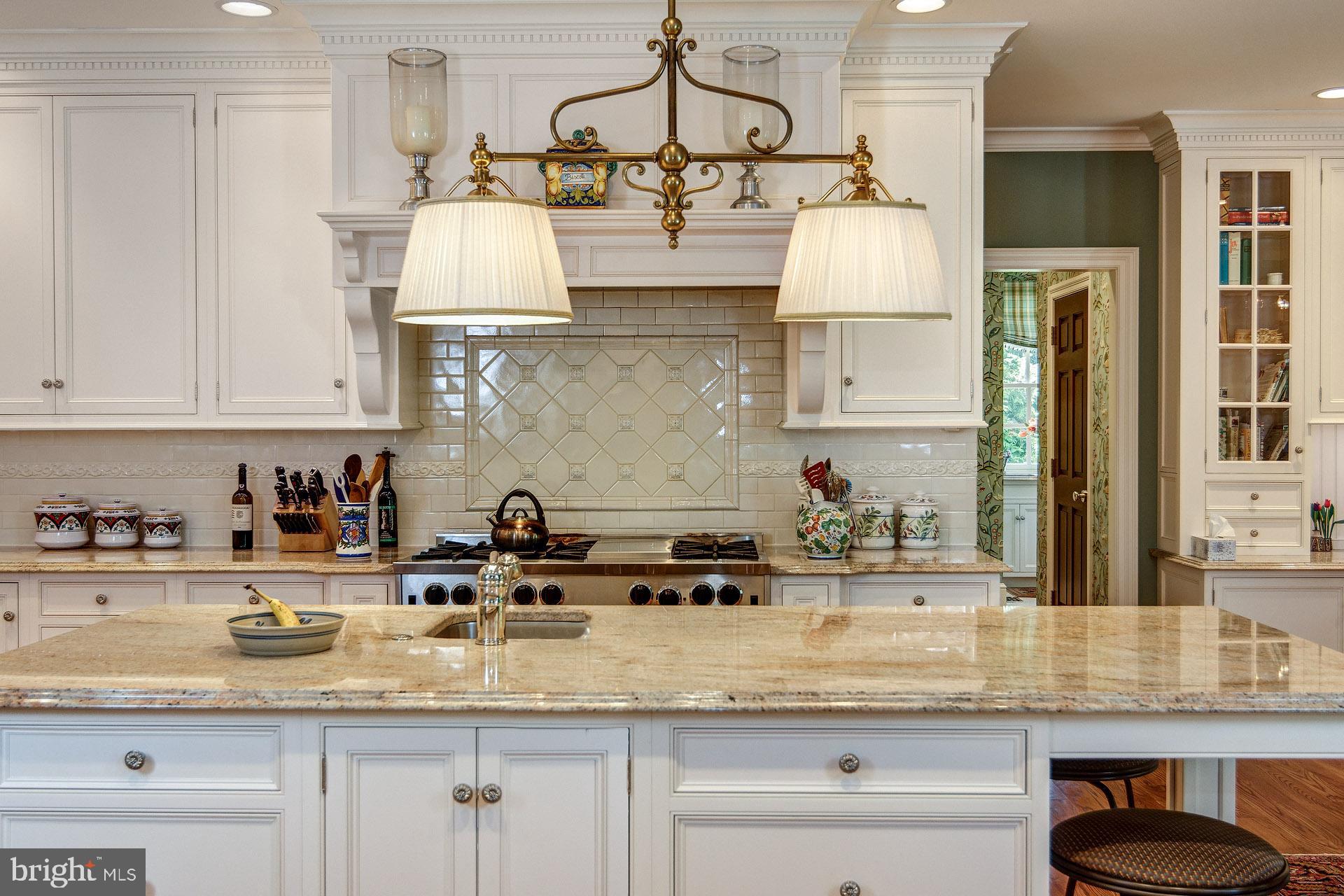 135 Winding Way Haddonfield, NJ 08033 - Photo 28 of 100 a kitchen with kitchen island granite countertop stainless steel appliances a sink and cabinets