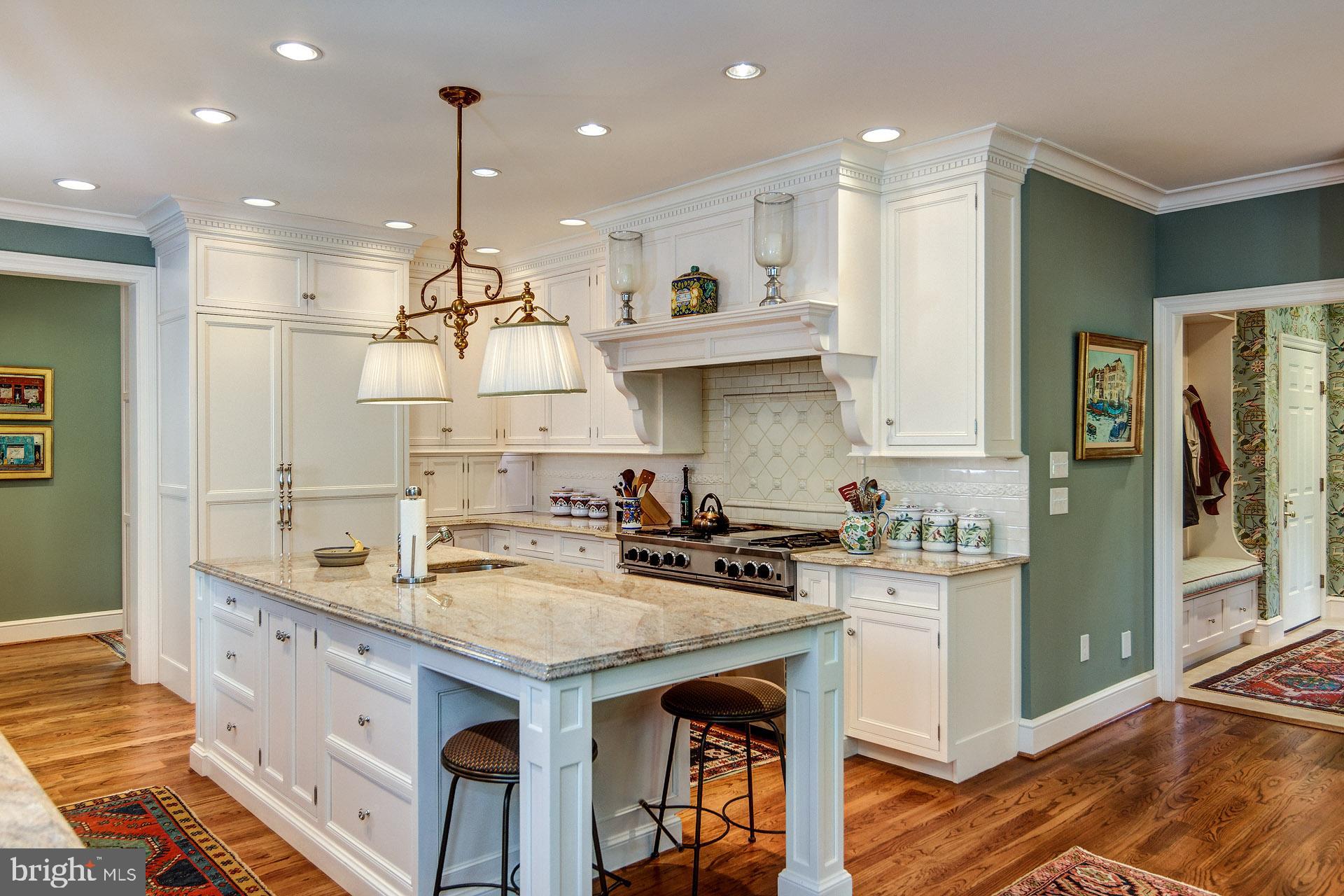 135 Winding Way Haddonfield, NJ 08033 - Photo 34 of 100 a kitchen with stainless steel appliances granite countertop a sink a stove a refrigerator and island with wooden floor