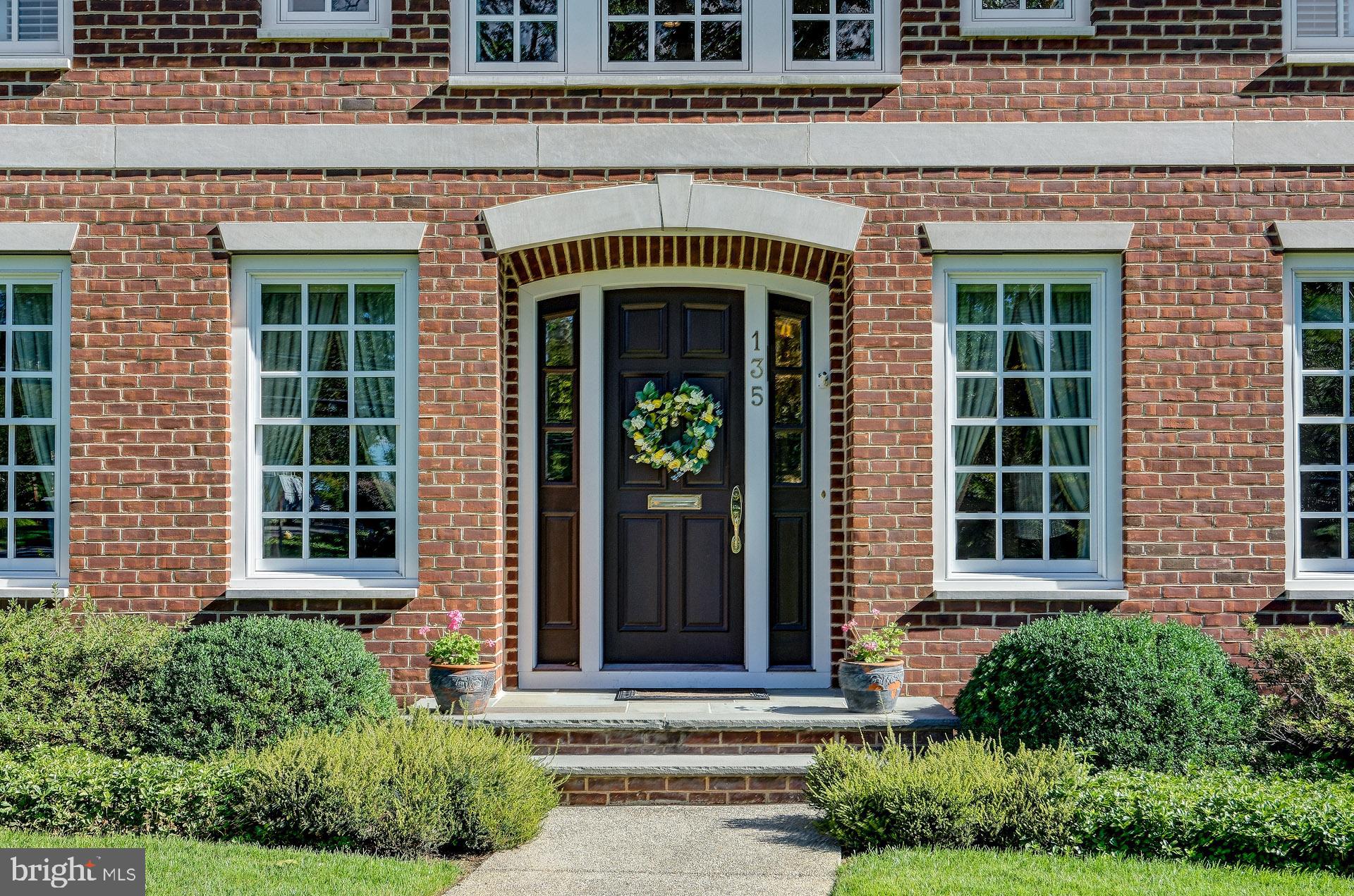 135 Winding Way Haddonfield, NJ 08033 - Photo 4 of 100 a front view of a house with large windows