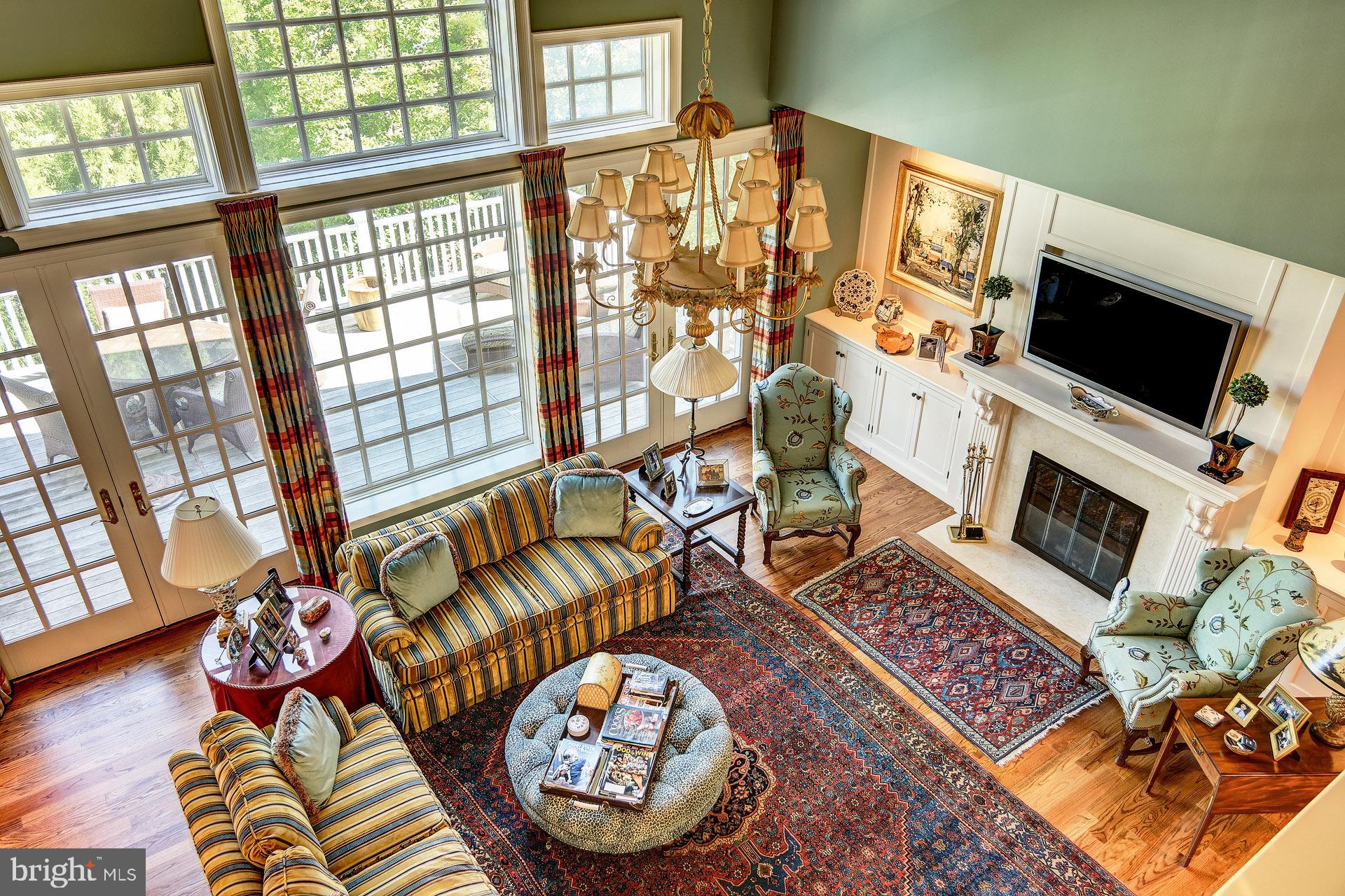 135 Winding Way Haddonfield, NJ 08033 - Photo 50 of 100 a living room with furniture and a flat screen tv