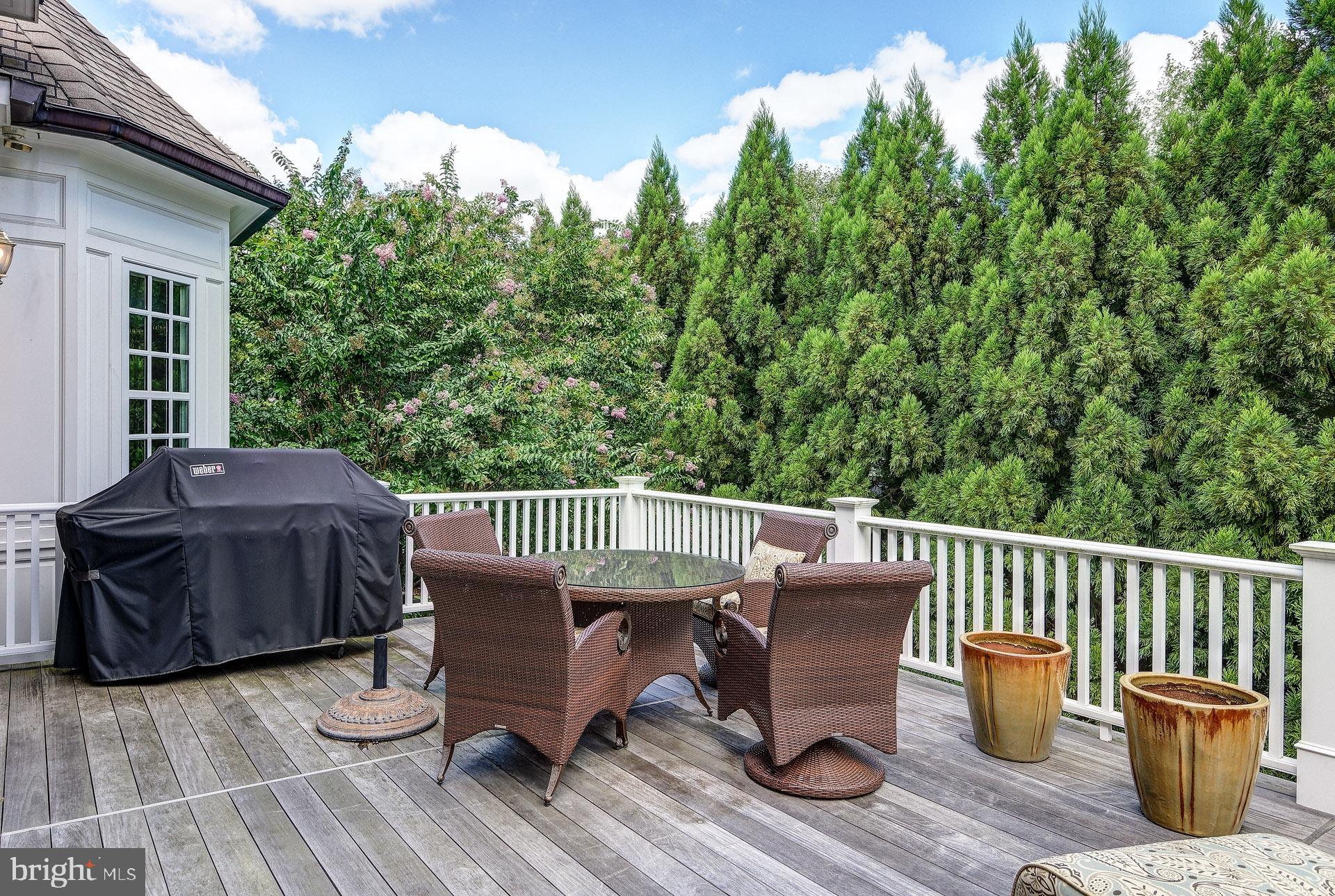 135 Winding Way Haddonfield, NJ 08033 - Photo 5 of 100 a view of a deck with chair and wooden floor