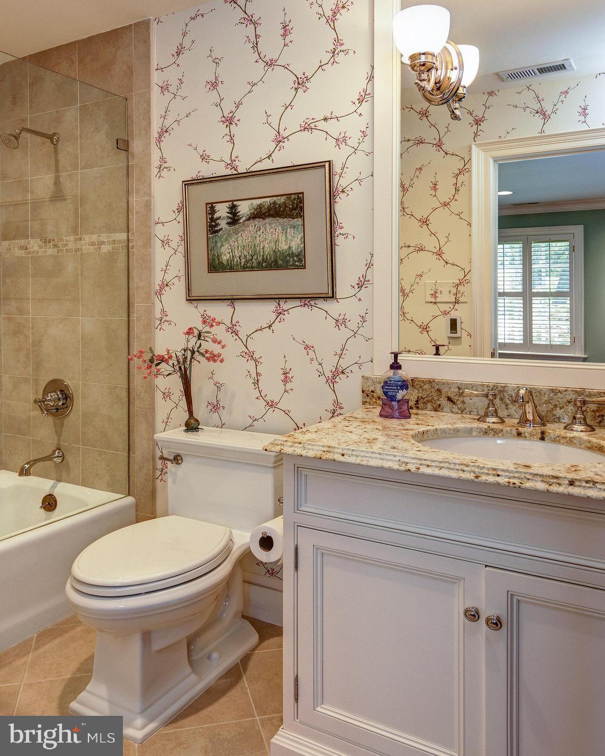 135 Winding Way Haddonfield, NJ 08033 - Photo 59 of 100 a bathroom with a granite countertop toilet a sink and a bathtub