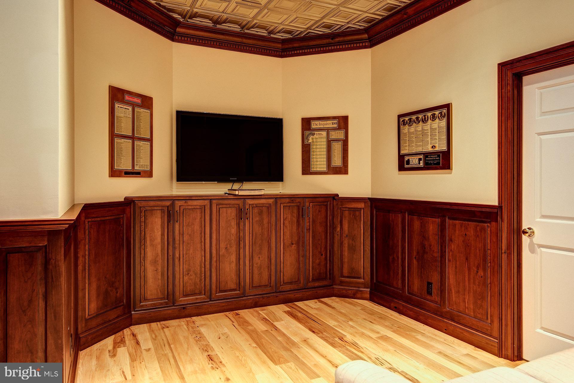 135 Winding Way Haddonfield, NJ 08033 - Photo 68 of 100 a view of a livingroom with wooden floor and a flat screen tv