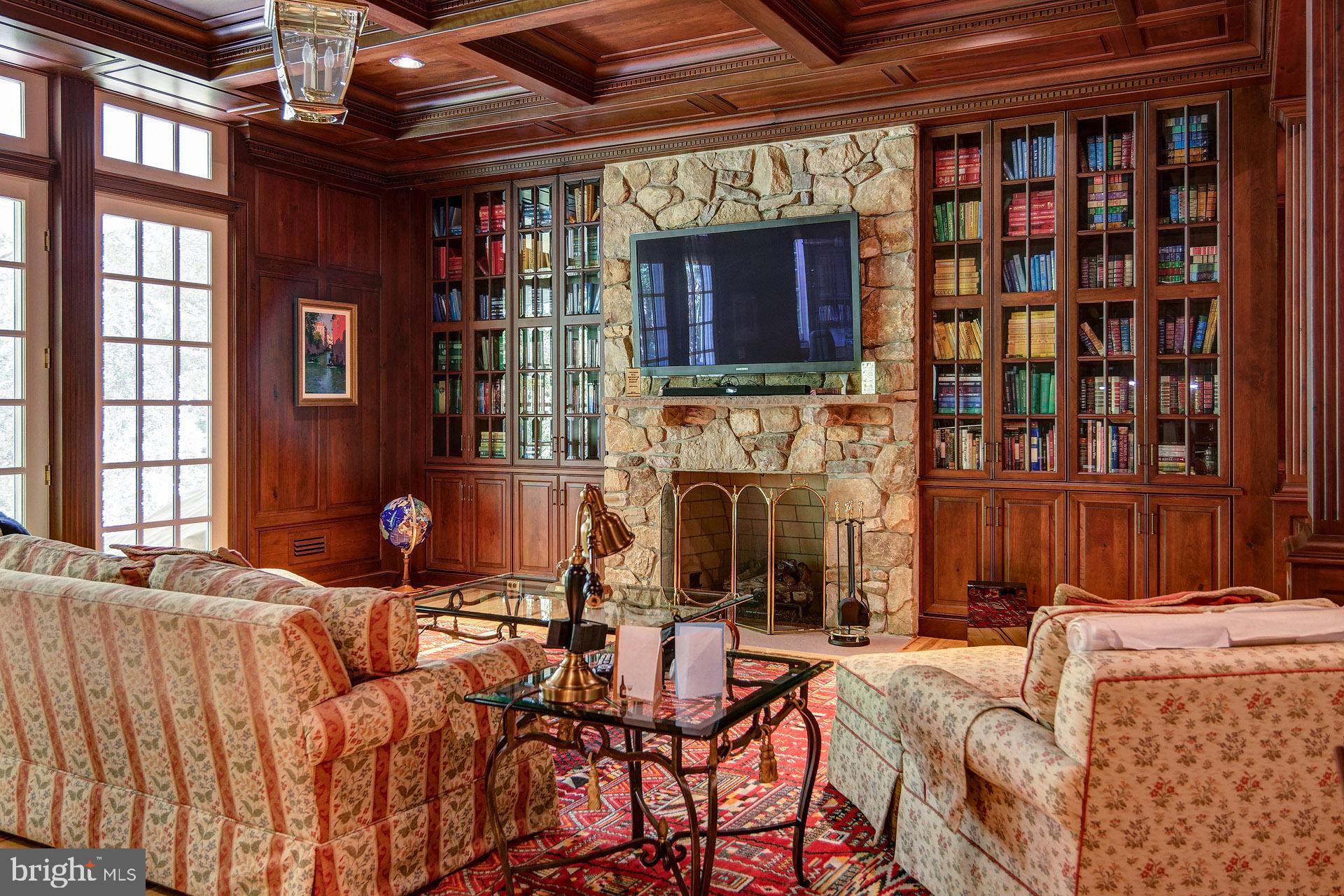 135 Winding Way Haddonfield, NJ 08033 - Photo 73 of 100 a living room with furniture a fireplace and a flat screen tv