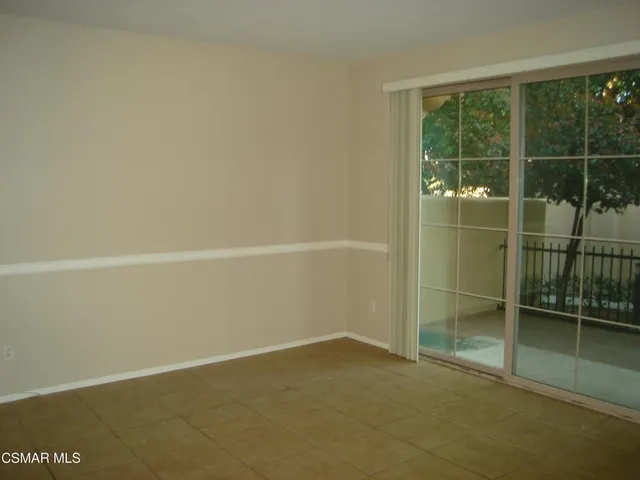 a view of a room that has a window in it