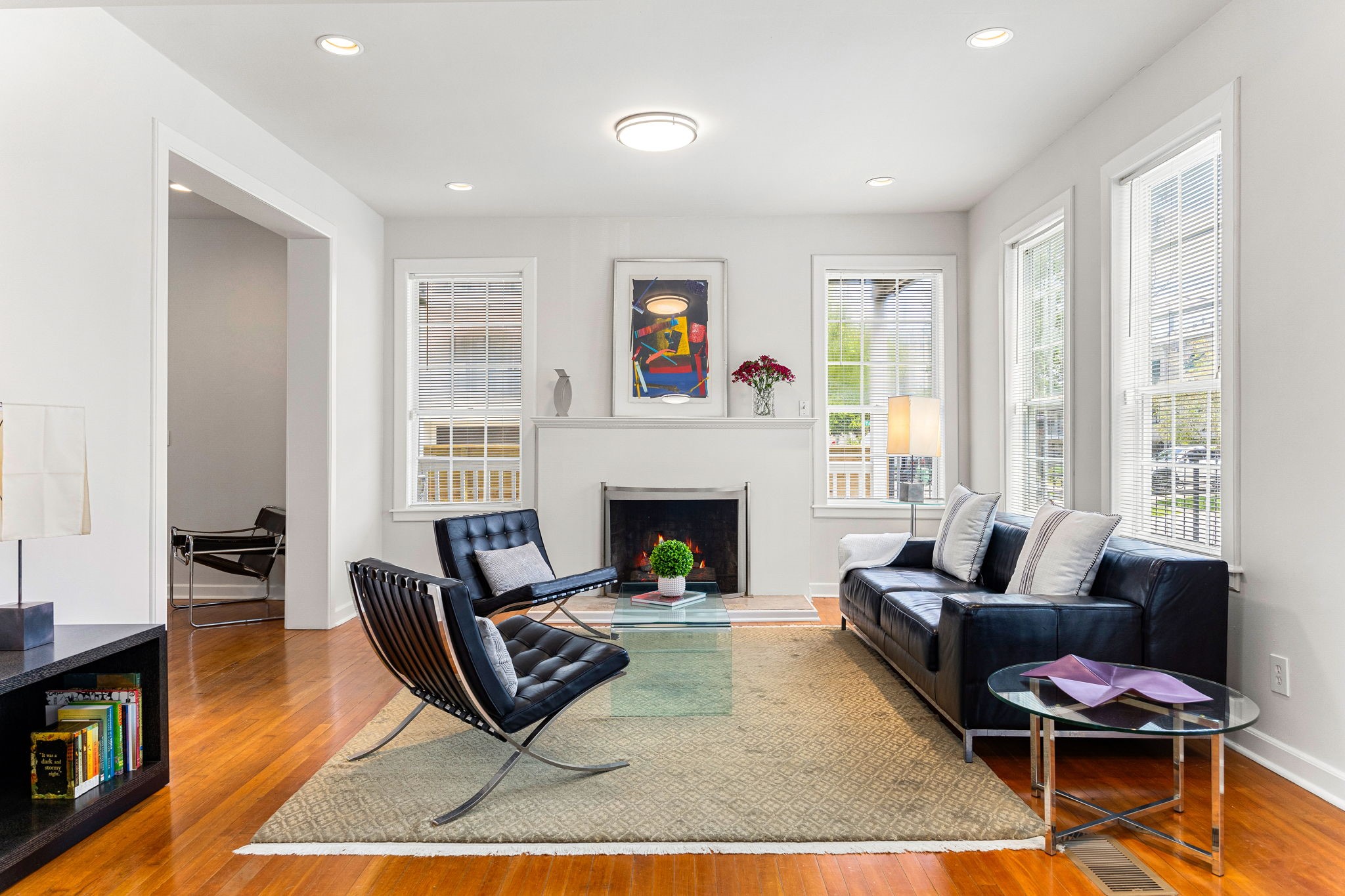 302 West Drew Street Houston, TX 77006 - Photo 13 of 48 a living room with furniture a rug wooden floor and a fireplace
