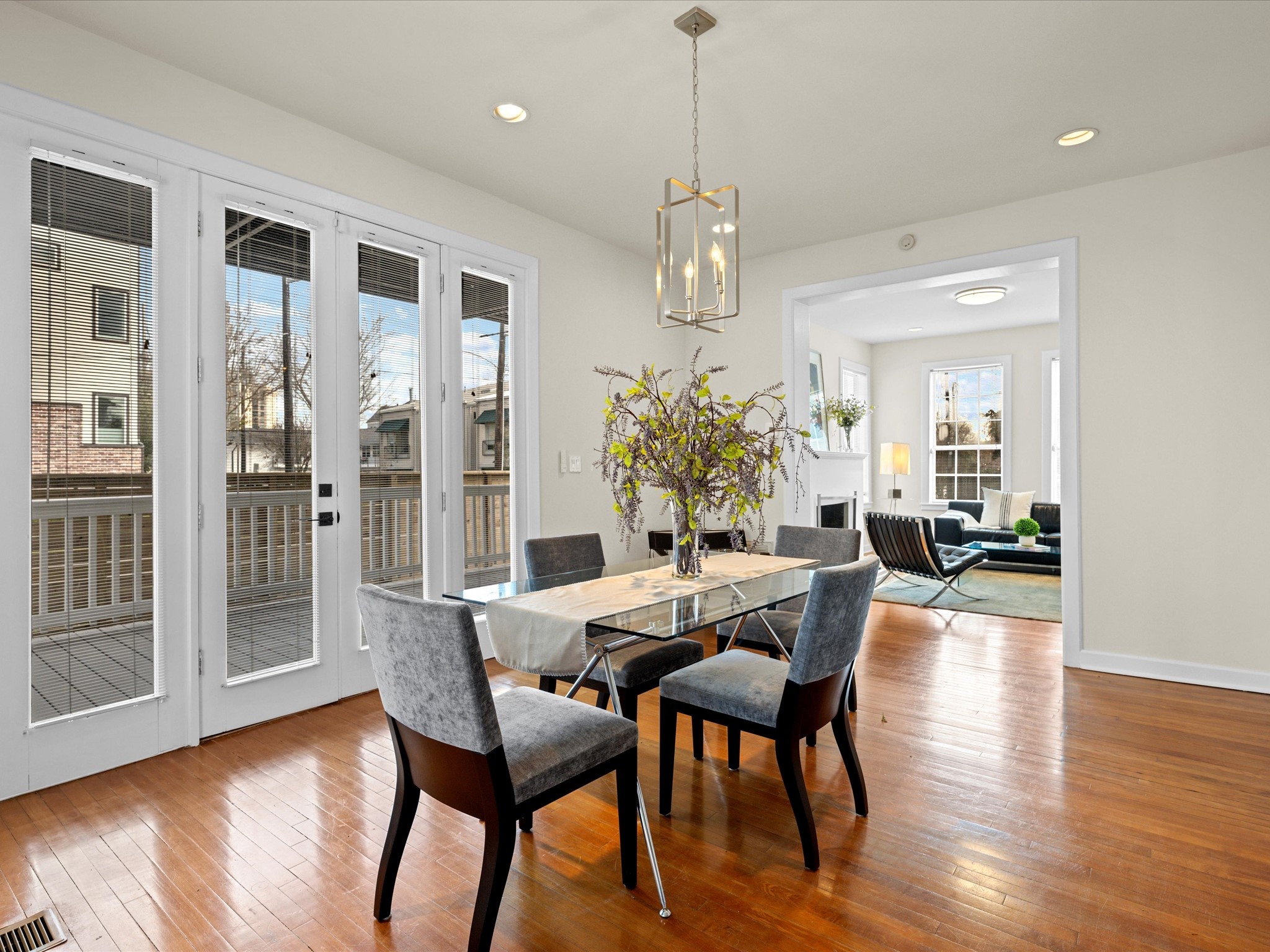302 West Drew Street Houston, TX 77006 - Photo 16 of 48 a view of a dining room with furniture wooden floor and chandelier