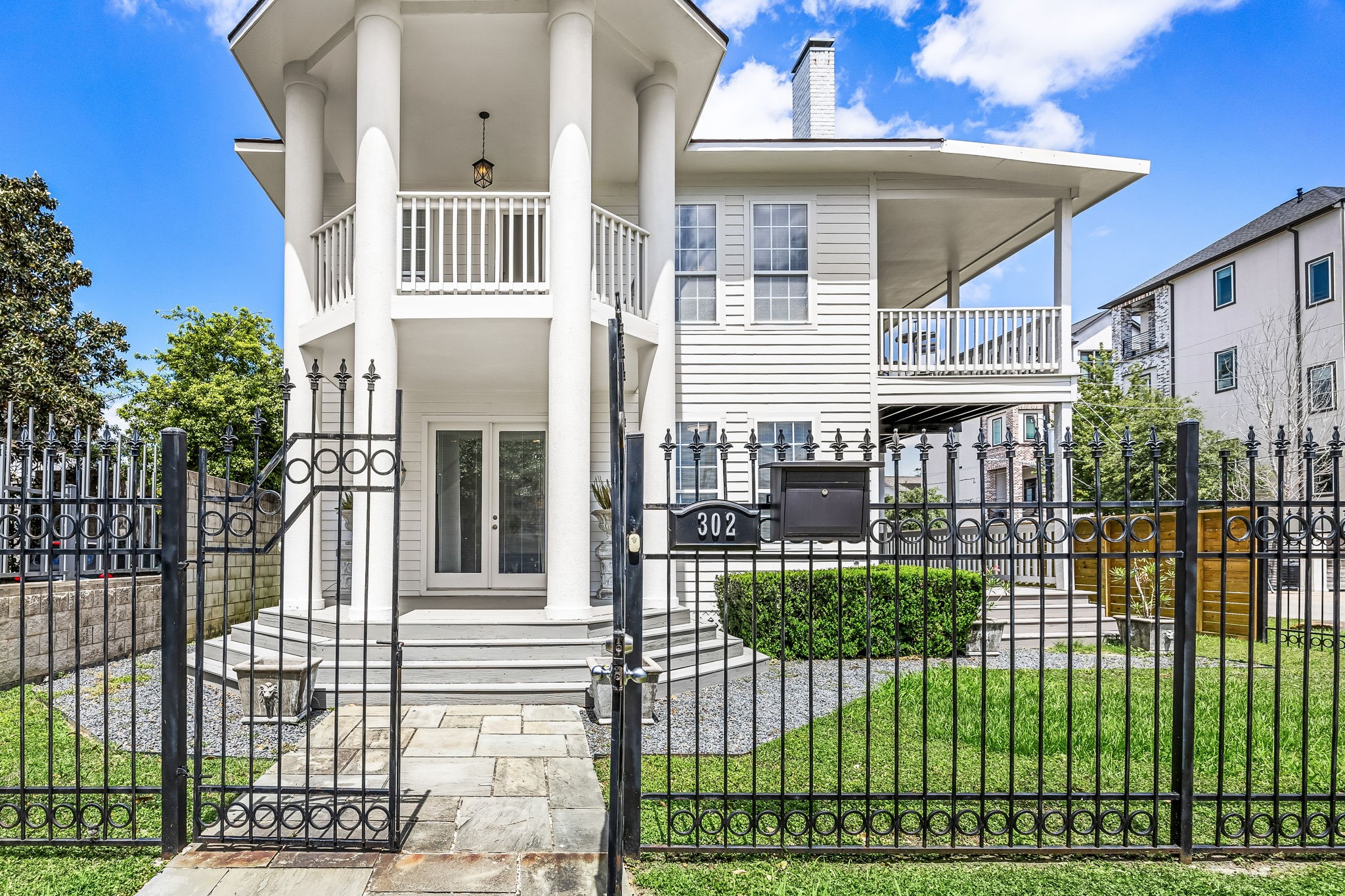 302 West Drew Street Houston, TX 77006 - Photo 3 of 48 Elegant columns greet your guests with a welcoming front porch entrance. The property is completely fenced.