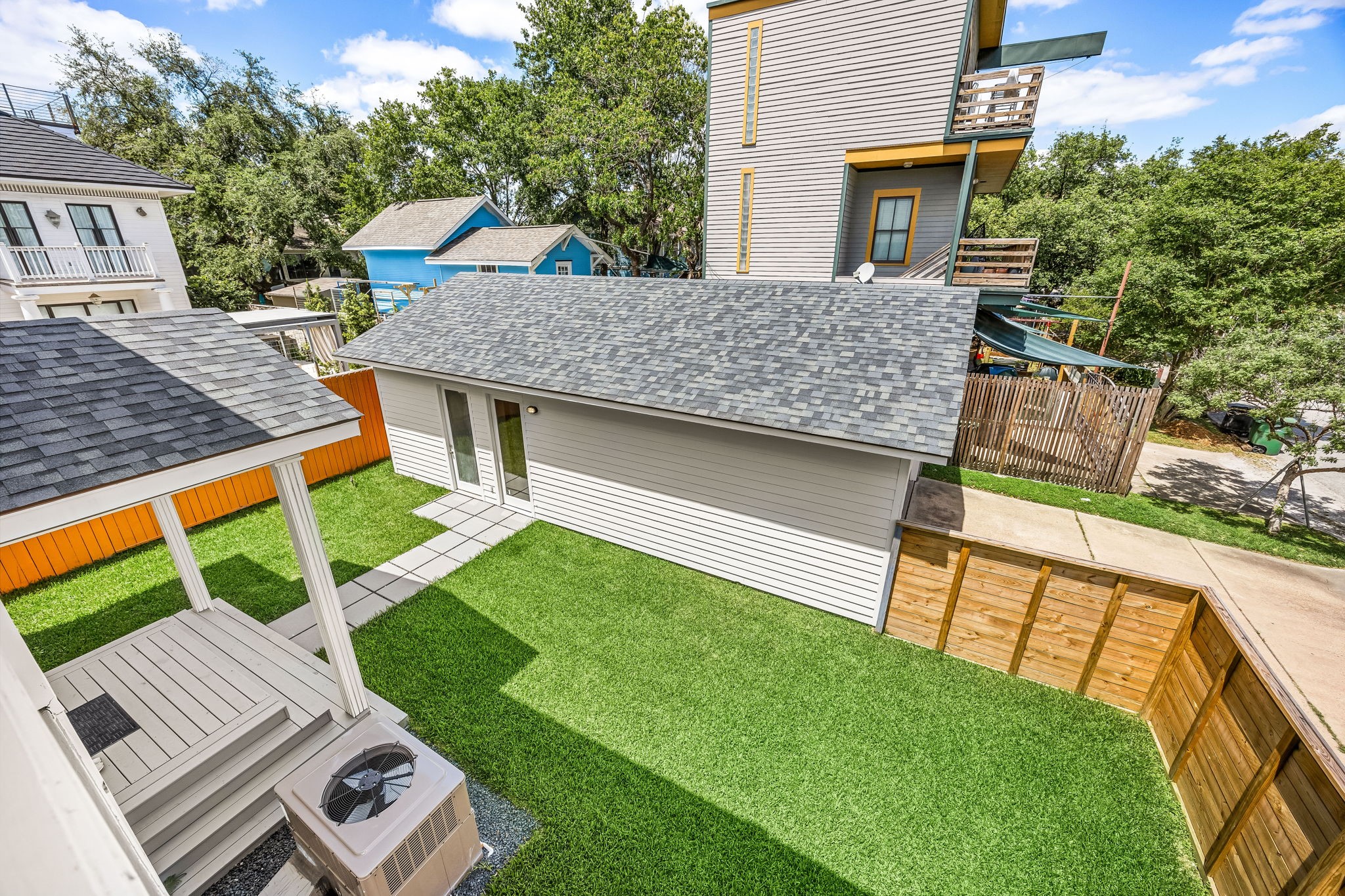 302 West Drew Street Houston, TX 77006 - Photo 35 of 48 Fully-sodded backyard with walkway to the oversized two-car garage and additional flex room (currently an exercise room).