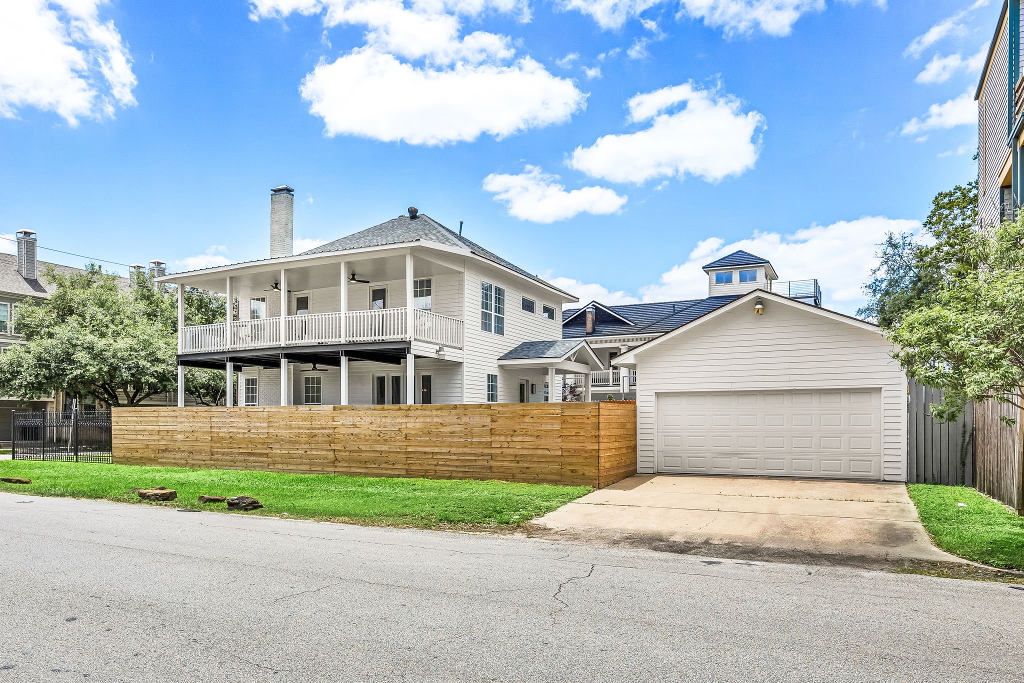 302 West Drew Street Houston, TX 77006 - Photo 5 of 48 a front view of a house with a yard and garage