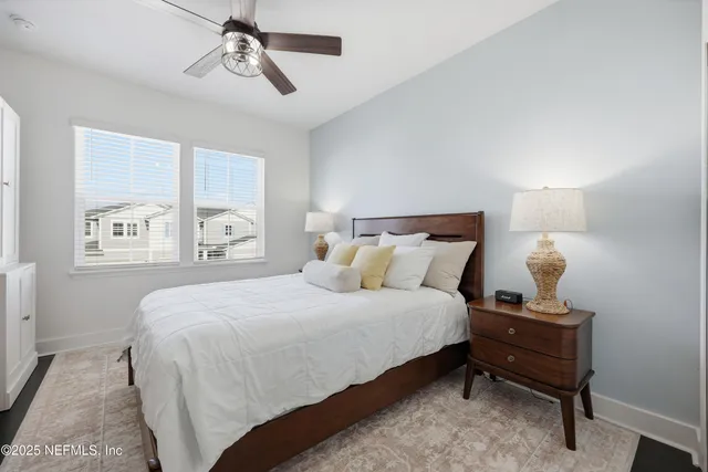 a bedroom with bed and window