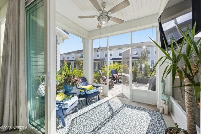 a very nice looking room with a large window and dining table