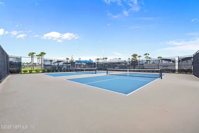 a view of swimming pool with outdoor seating and plants