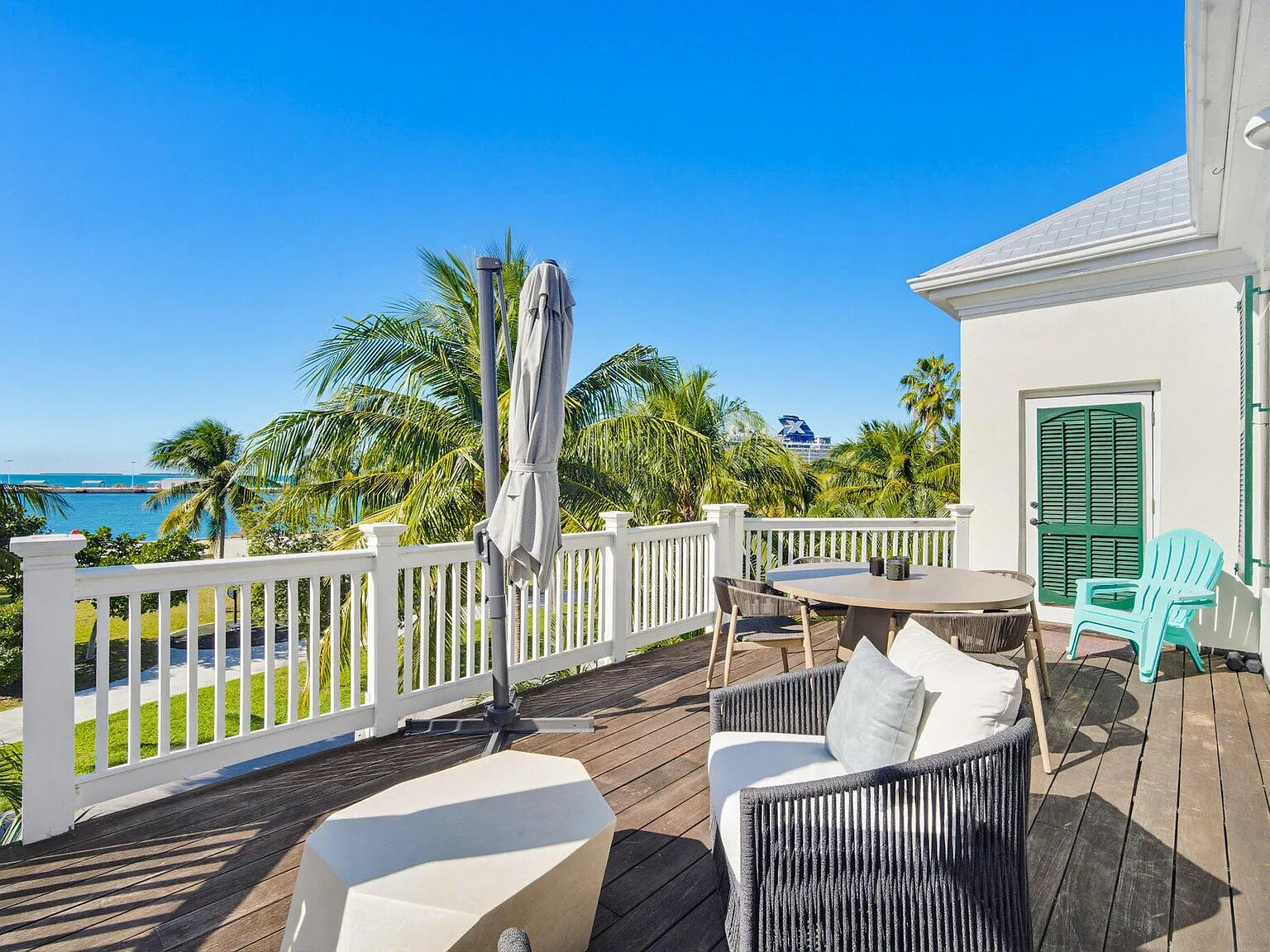 401 Emma Street, Unit H Key West, FL 33040 - Photo 4 of 53 a view of a patio with a table chairs and a table