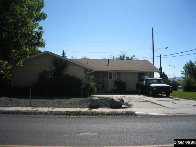 700 Wyoming Avenue Reno, NV 89503 - Photo 1 of 9 a front view of a house with a yard and garage