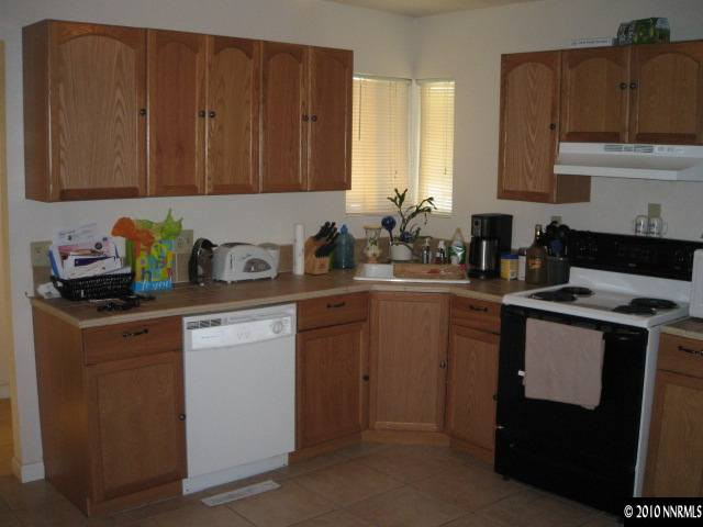 700 Wyoming Avenue Reno, NV 89503 - Photo 3 of 9 a kitchen with sink cabinets and stove top oven