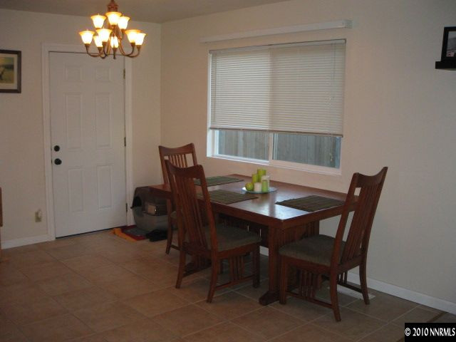 700 Wyoming Avenue Reno, NV 89503 - Photo 4 of 9 a view of a dining room with furniture and chandelier
