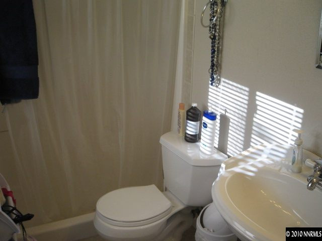 700 Wyoming Avenue Reno, NV 89503 - Photo 8 of 9 a white toilet sitting next to a bathroom sink